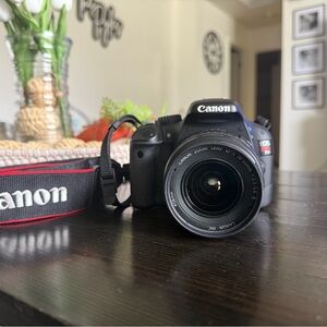 Canon DSLR Camera in Black with Red-Trim Strap